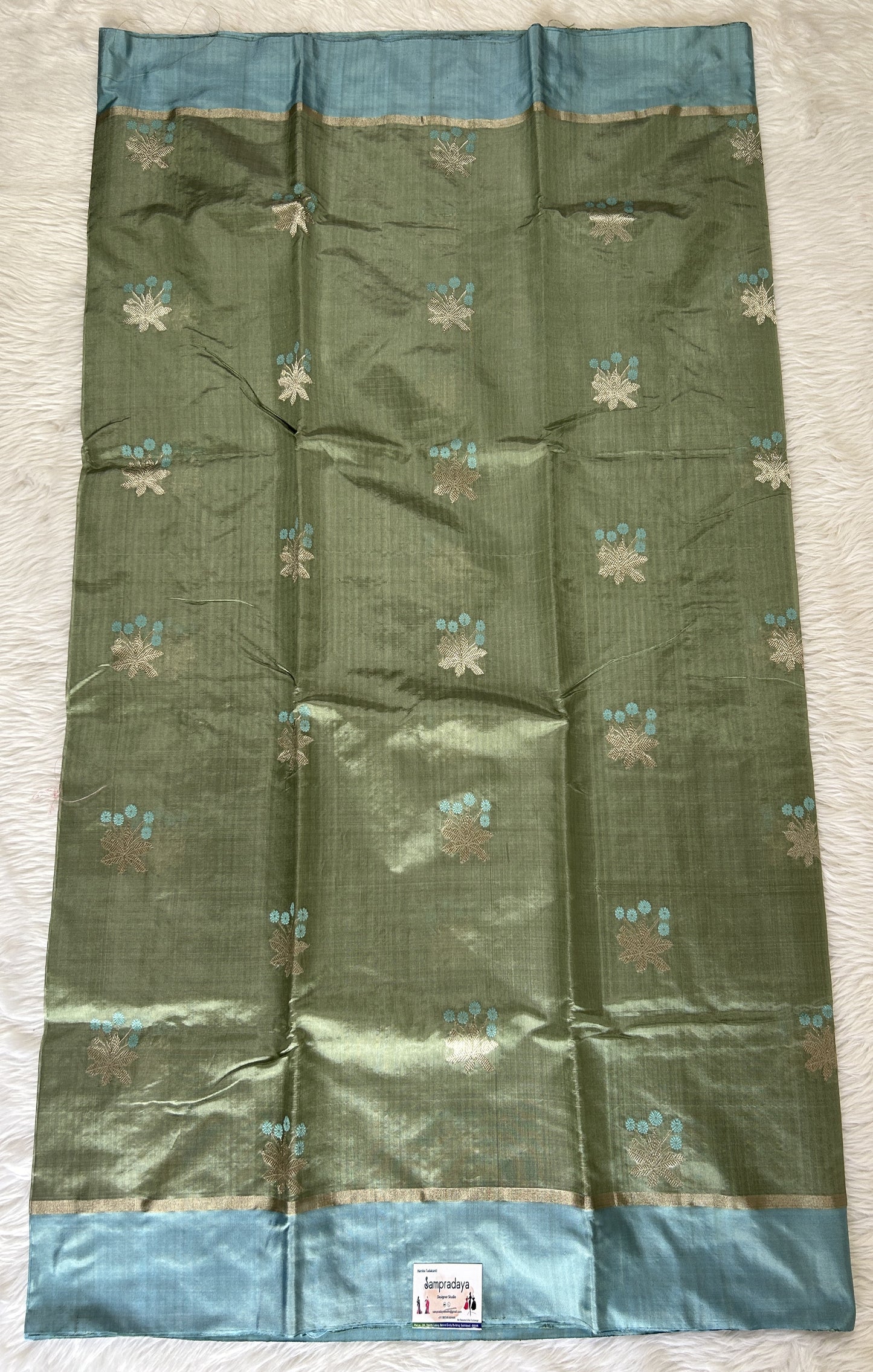 Chanderi Pattu Saree Light Olive Green colored saree complemented with a Sky Blue Plain border - Sampradaya Designer Studio