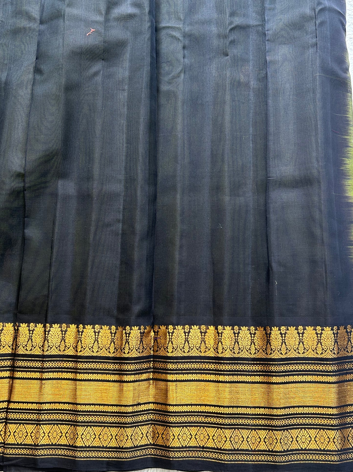 Gadwal Sico Saree Olive Green colored complemented with a Gold Zari Border