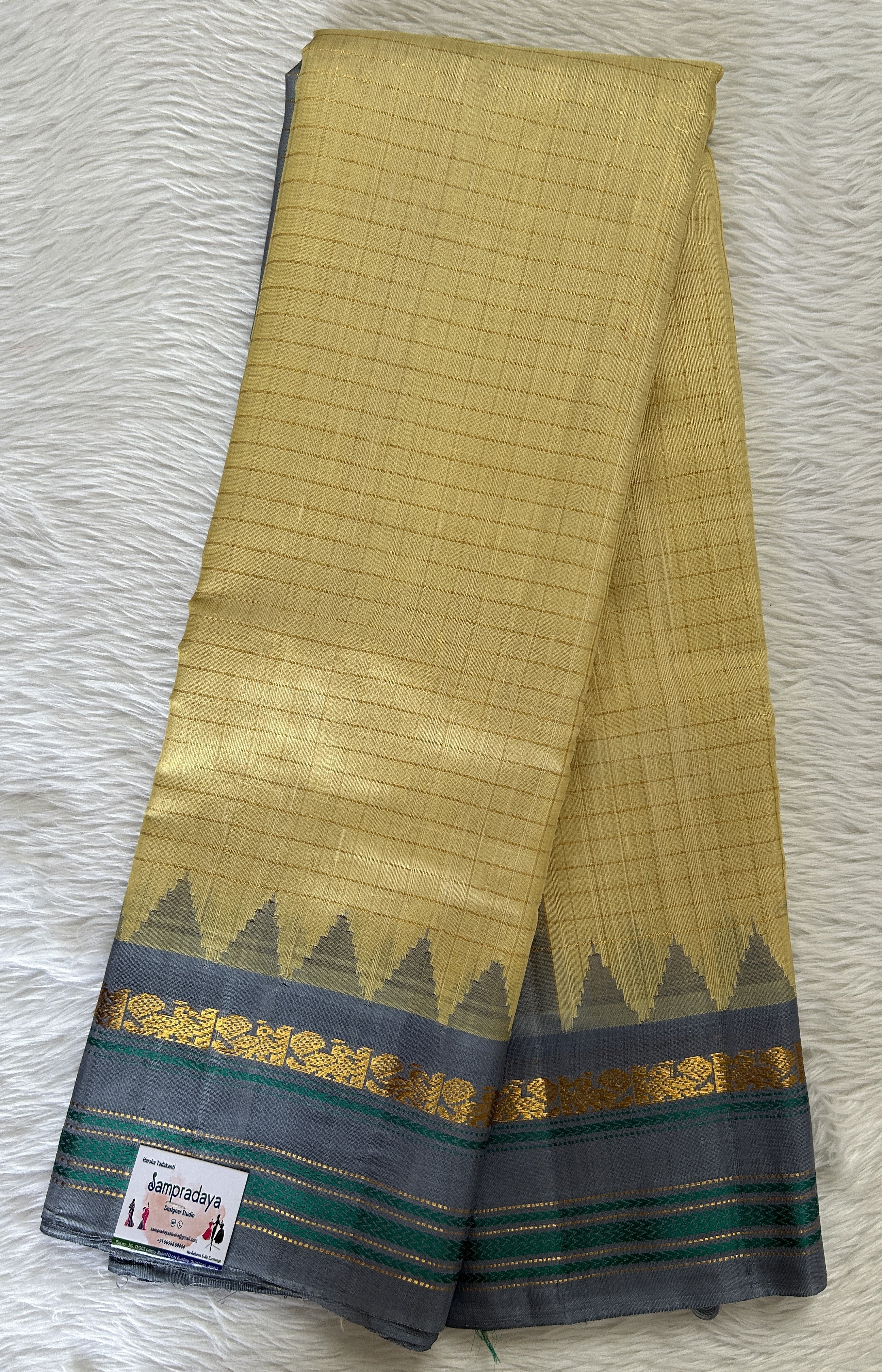 Gadwal Pattu Pastel Yellow Colored Saree Complemented With a Pattu Gra ...