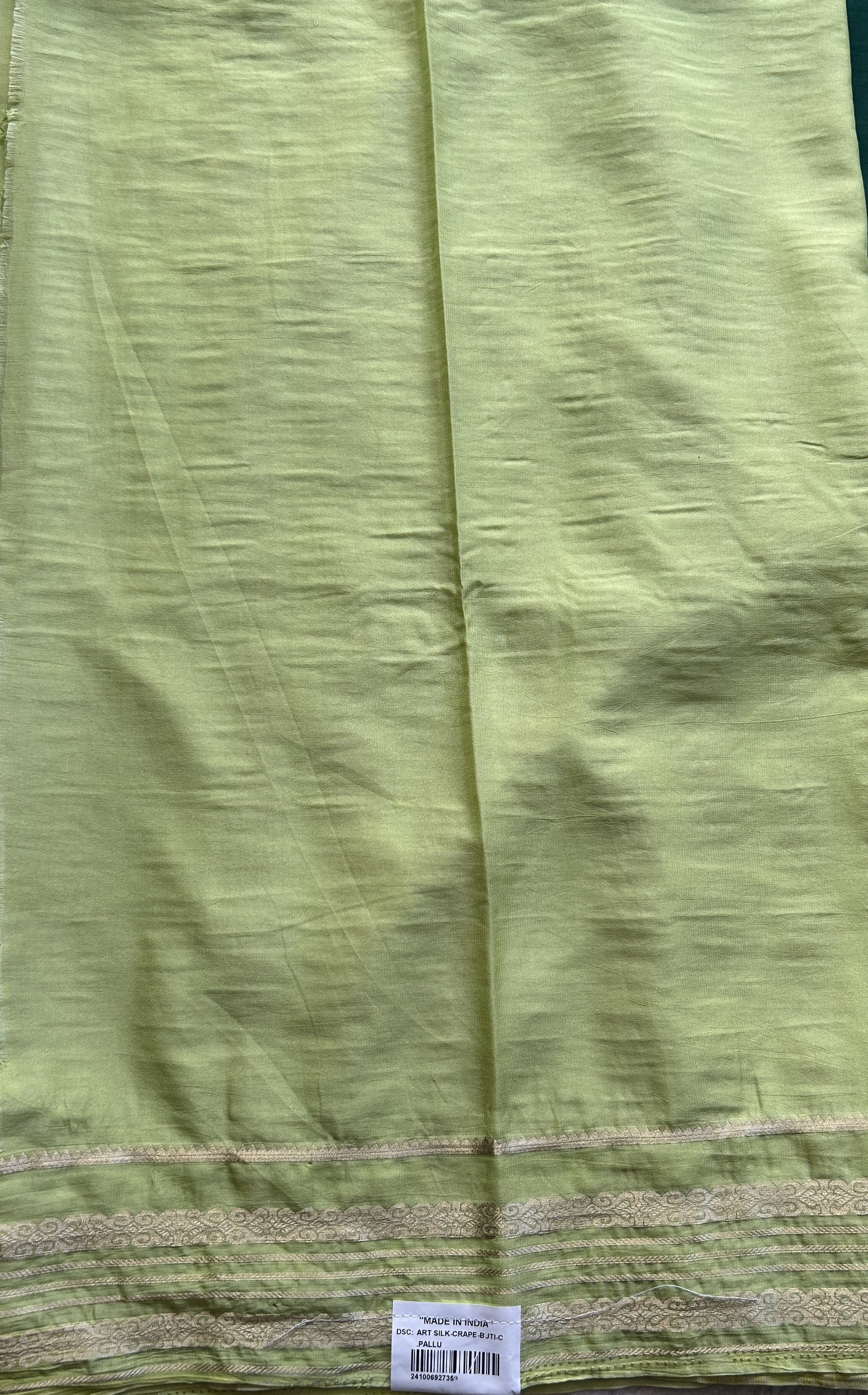 Semi Georgette Saree Dark Green Colored elegantly adorned with a Zari Border. - Sampradaya Designer Studio