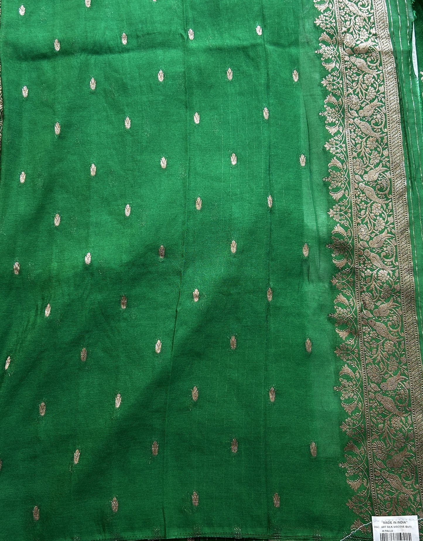 Semi Georgette Saree Green Colored elegantly adorned with a Zari Border. - Sampradaya Designer Studio