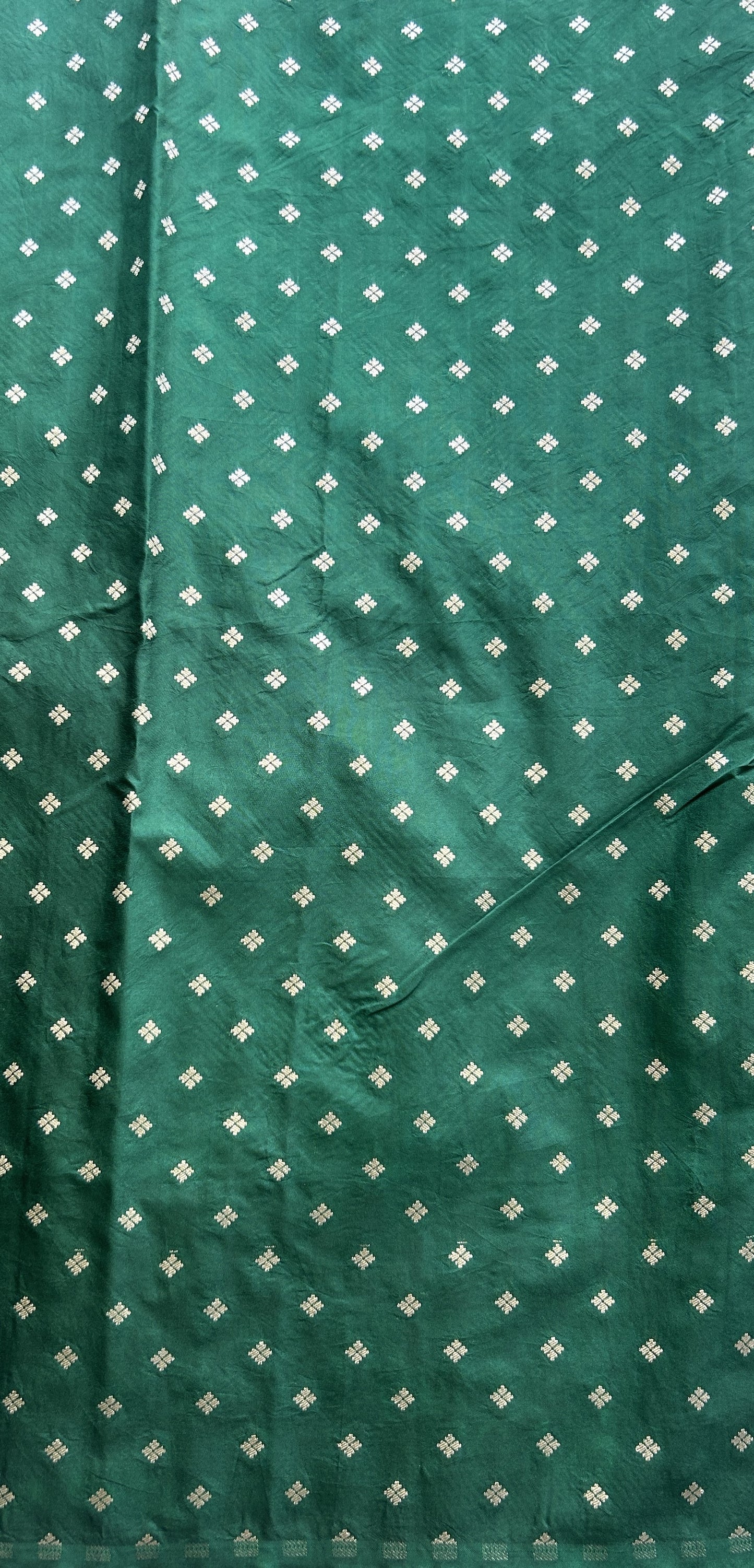 Semi Raw Silk Saree Bottle Green Colored Elegantly Paired with a Zari Border. - Sampradaya Designer Studio