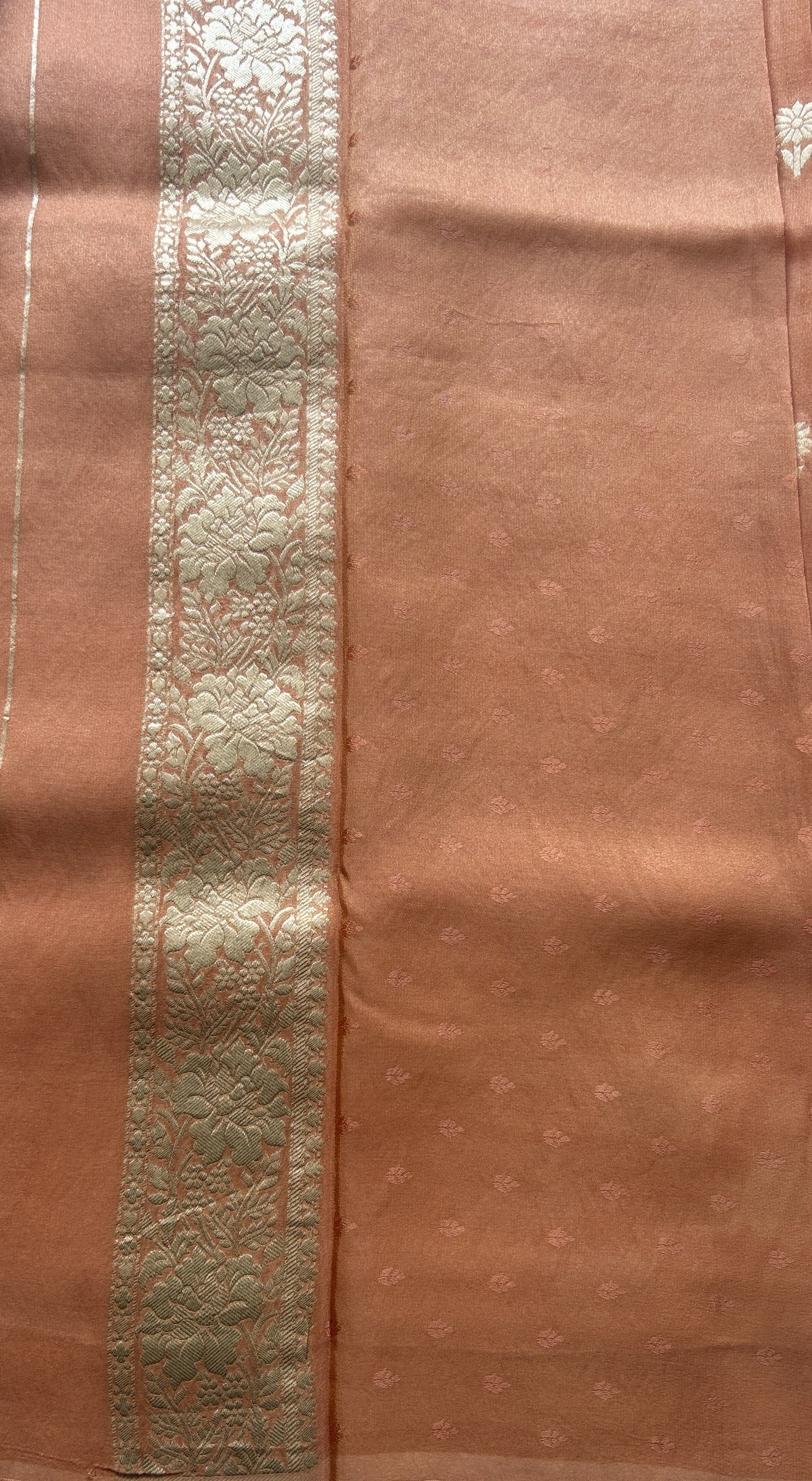 Semi Tissue Georgette Saree Peach Colored Paired with a Zari Border. - Sampradaya Designer Studio