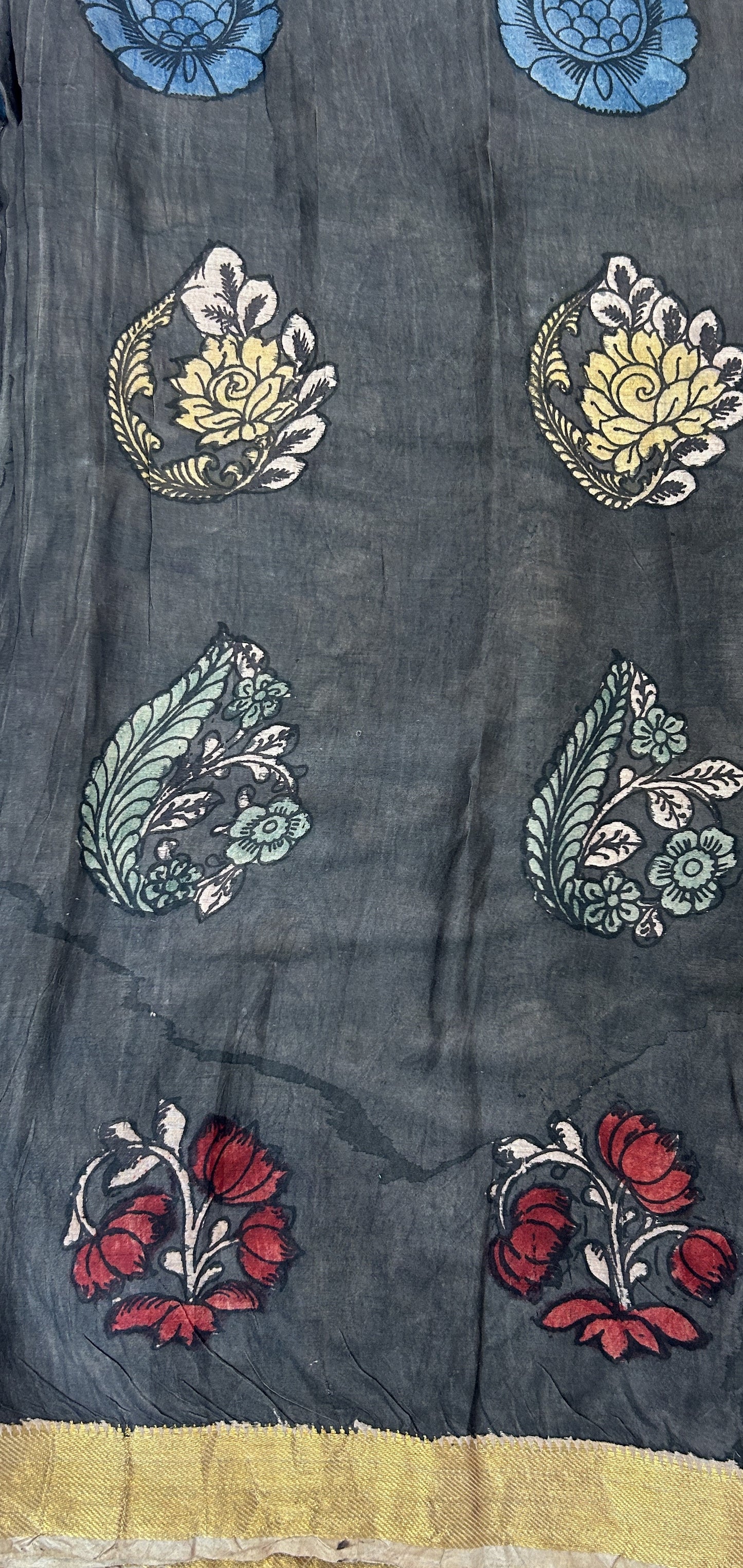 Pen Kalamkari Saree Red colored allover saree complemented with a Gold Zari border - Sampradaya Designer Studio