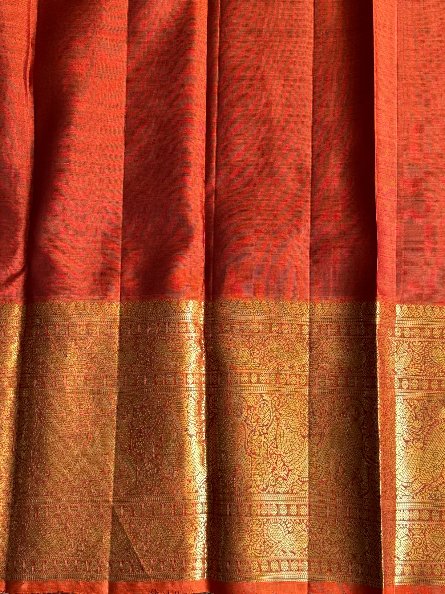 Pure Kanjivaram Silk Saree Chocolate brown Colored Elegantly Paid with a Gold Zari Border.