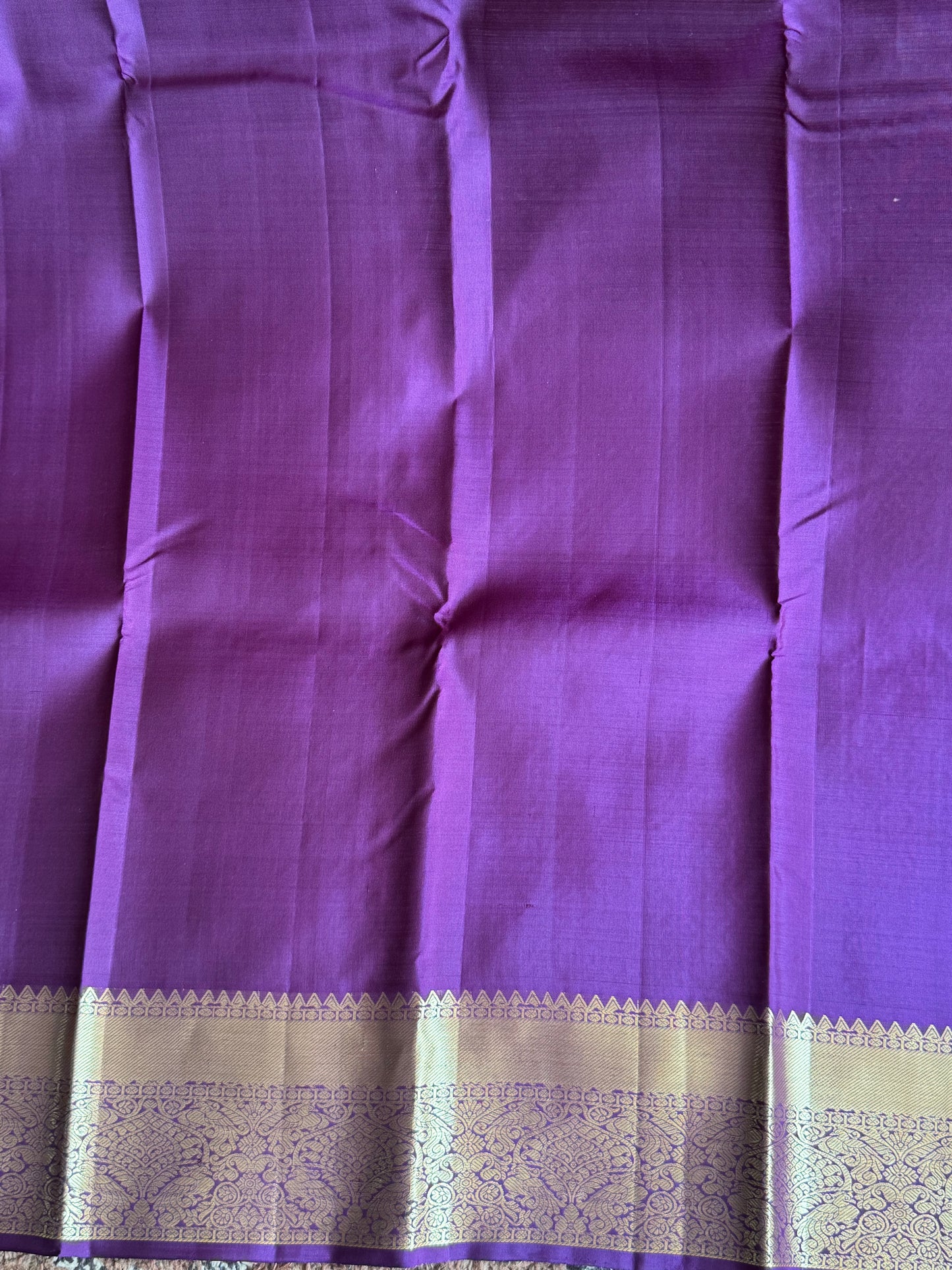 Pure Kanjivaram Silk Saree Purple Colored with Gold Zari Border.