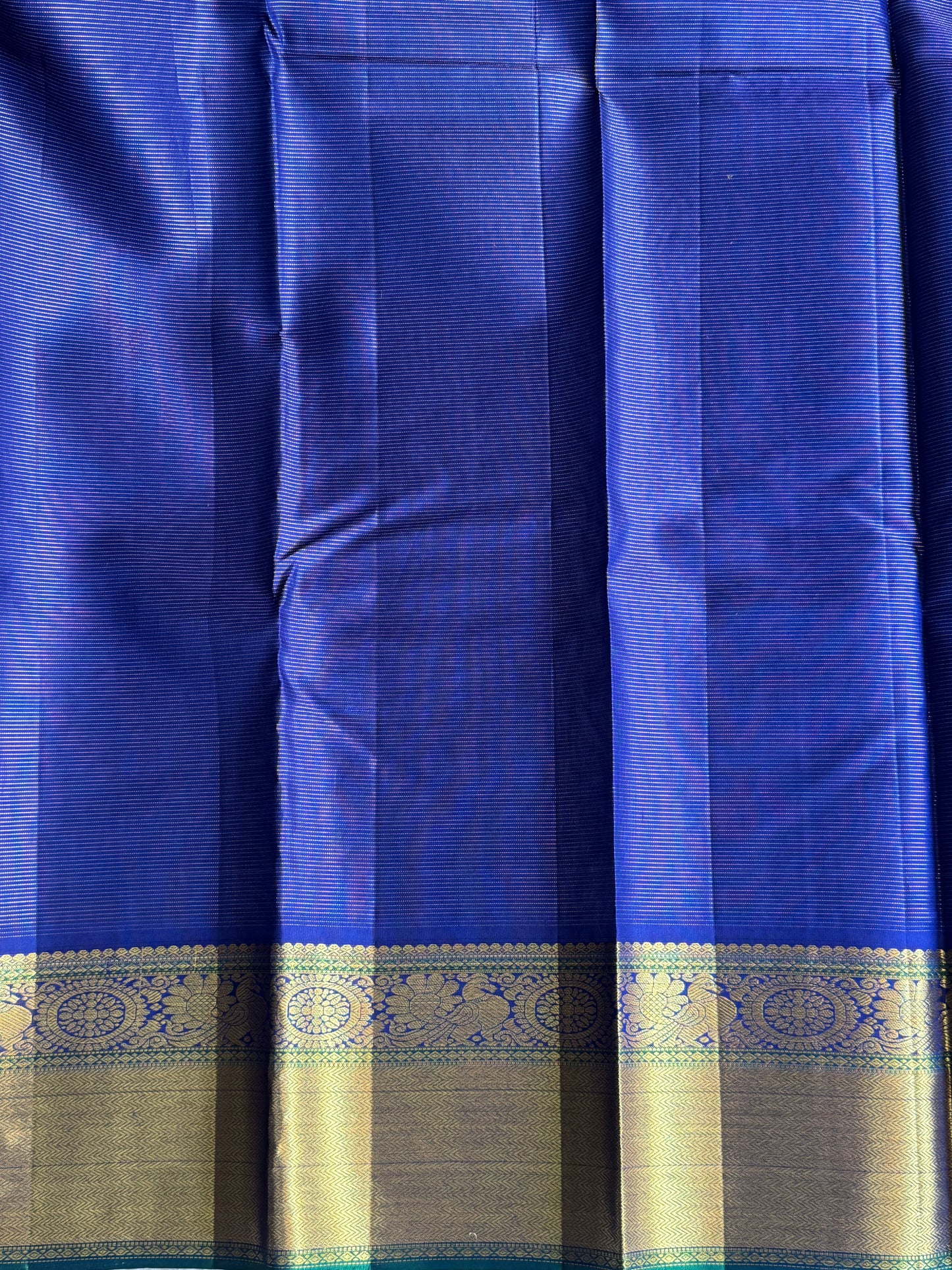 Pure Kanjivaram Silk Saree Royal Blue Colored Elegantly Paid with a Gold Zari Border