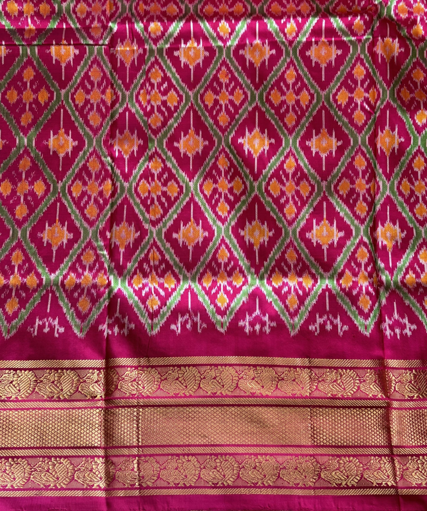 Ikkat Pattu Saree Black colored complemented with a Kanchi border. - Sampradaya Designer Studio