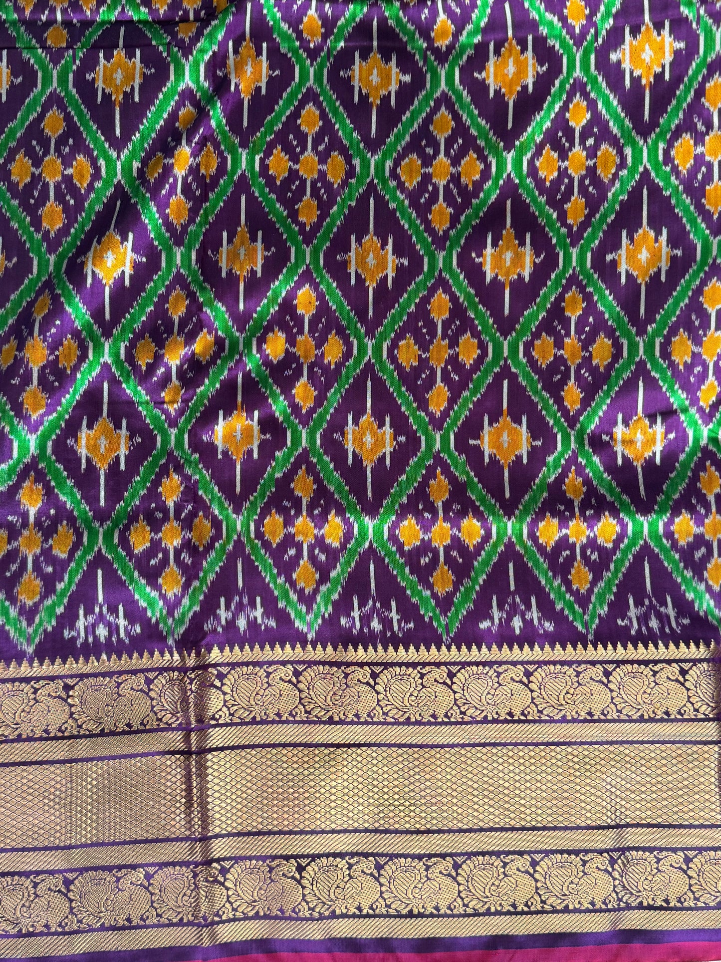 Ikkat Pattu Saree Violet colored complemented with a Kanchi border. - Sampradaya Designer Studio