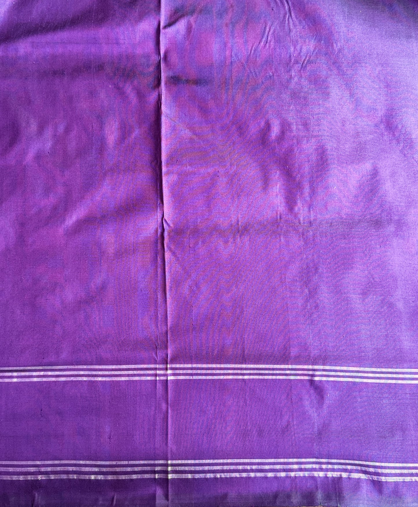 Ikkat Pattu Saree Violet colored complemented with a Patola border. - Sampradaya Designer Studio