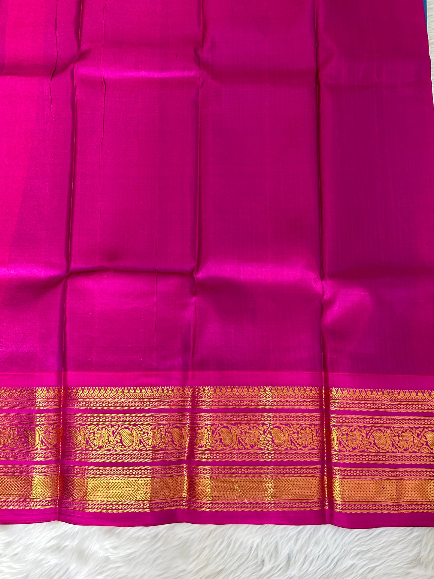 Gadwal Pattu Saree Deep Sea Blue-colored saree complemented with a magenta pink border - Sampradaya Designer Studio
