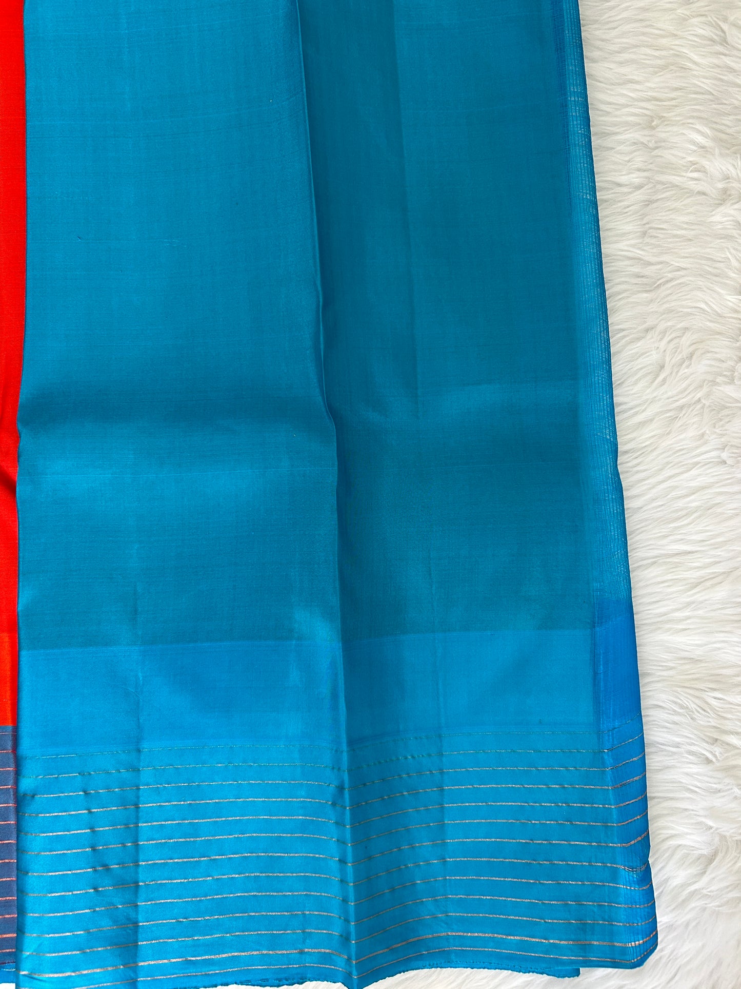 Gadwal Pattu Saree Red-colored saree complemented with a Blue border - Sampradaya Designer Studio