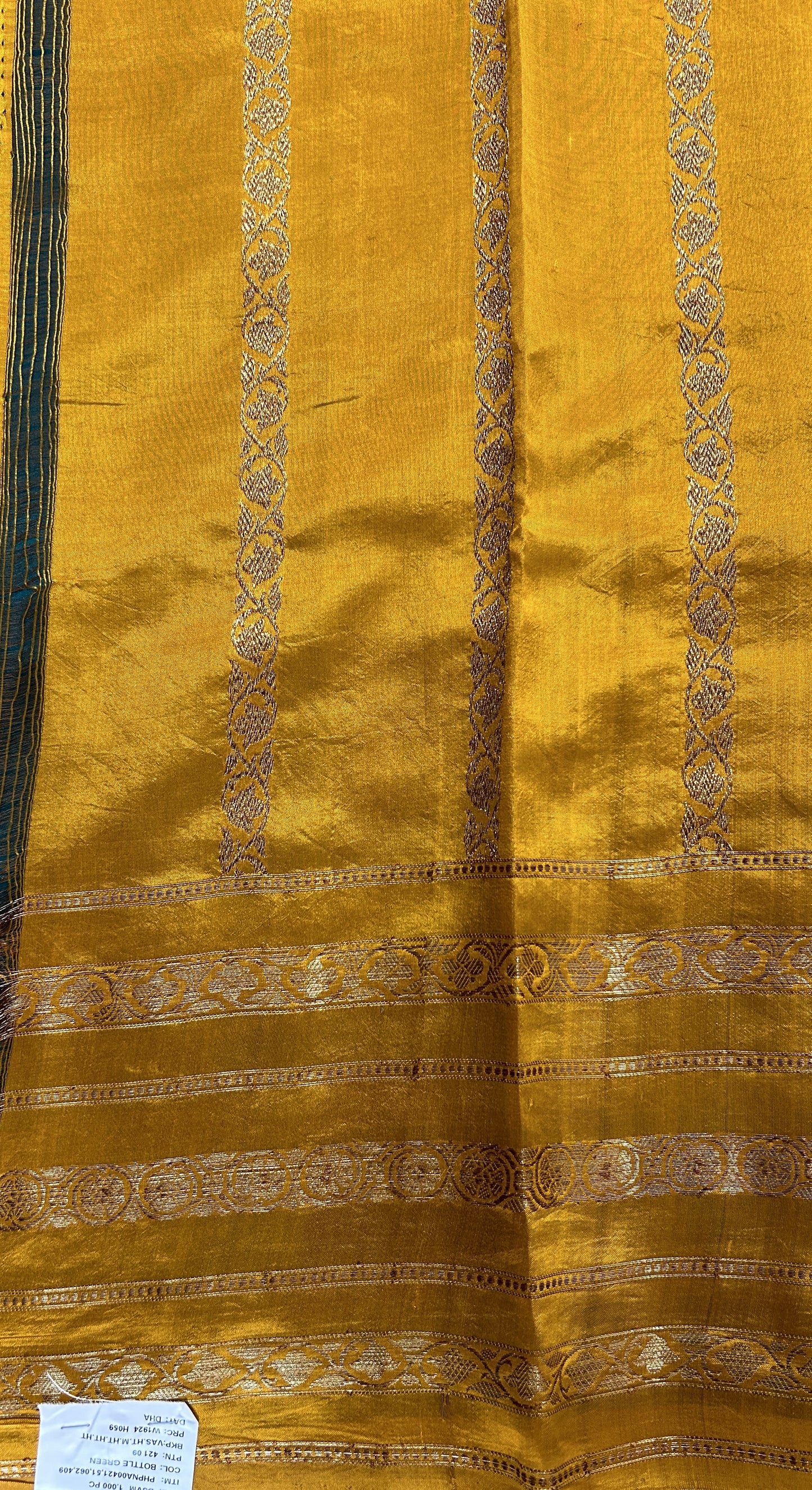 Raw Mango or Pooniya Silk Saree Bottle Green Colored Complemented With a Gap Border - Sampradaya Designer Studio