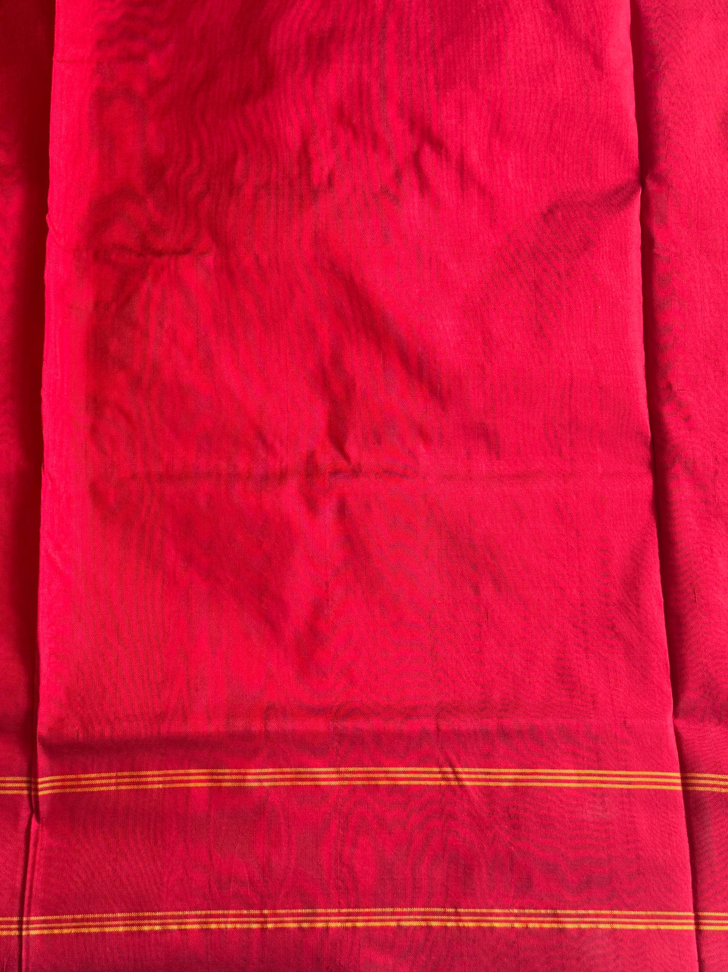Ikkat Pattu Saree Gray colored complemented with a Red Patola border. - Sampradaya Designer Studio