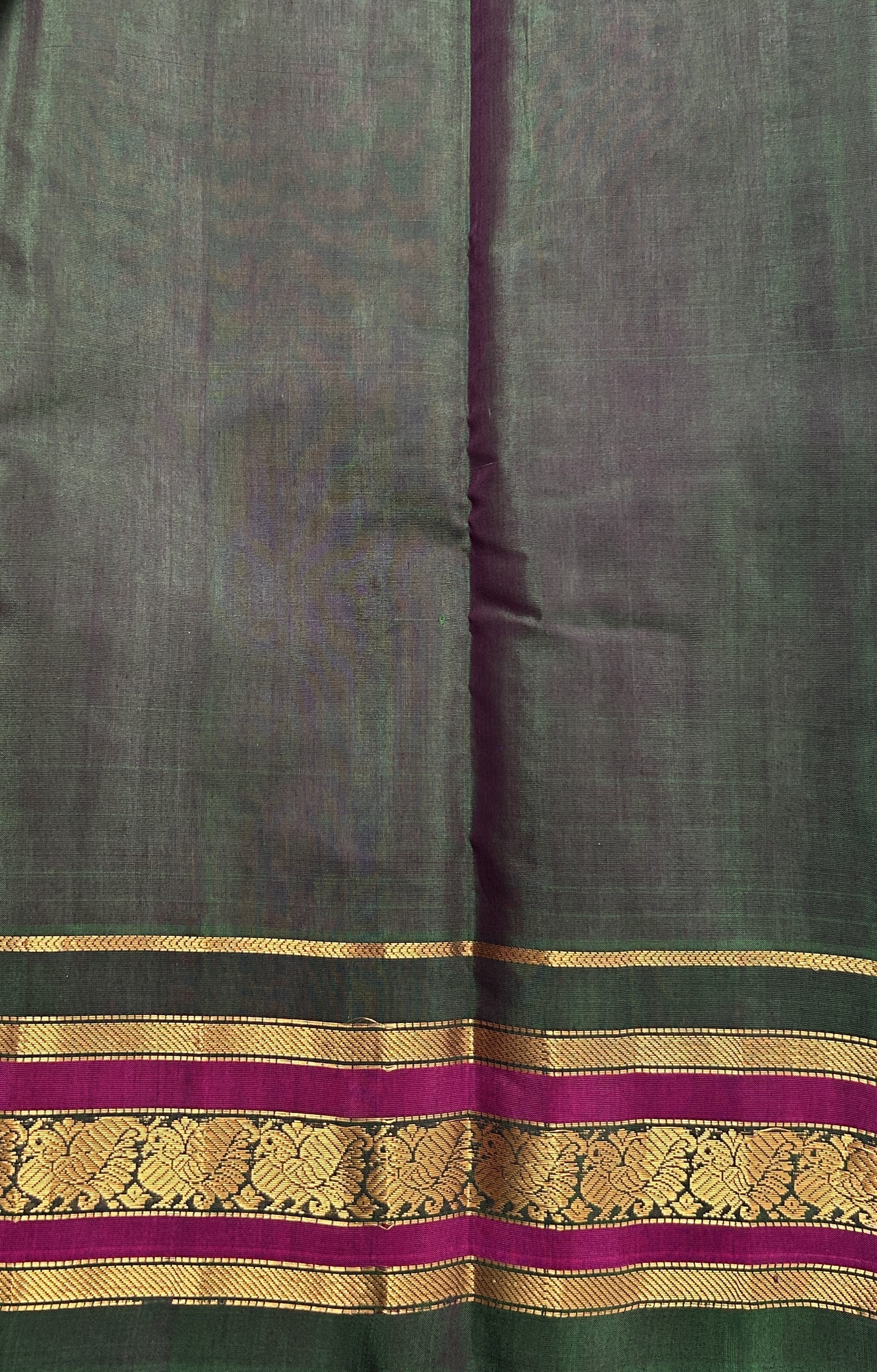 Gadwal Sico Saree Gray colored complemented with a Green Kanchi Gap Border. - Sampradaya Designer Studio