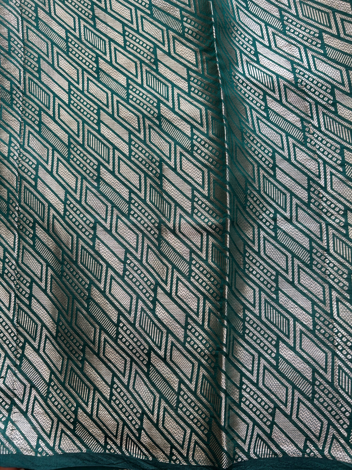 Pure Chiniya Silk Saree Bottle Green Colored Elegantly Paired with a Gold Zari Border.