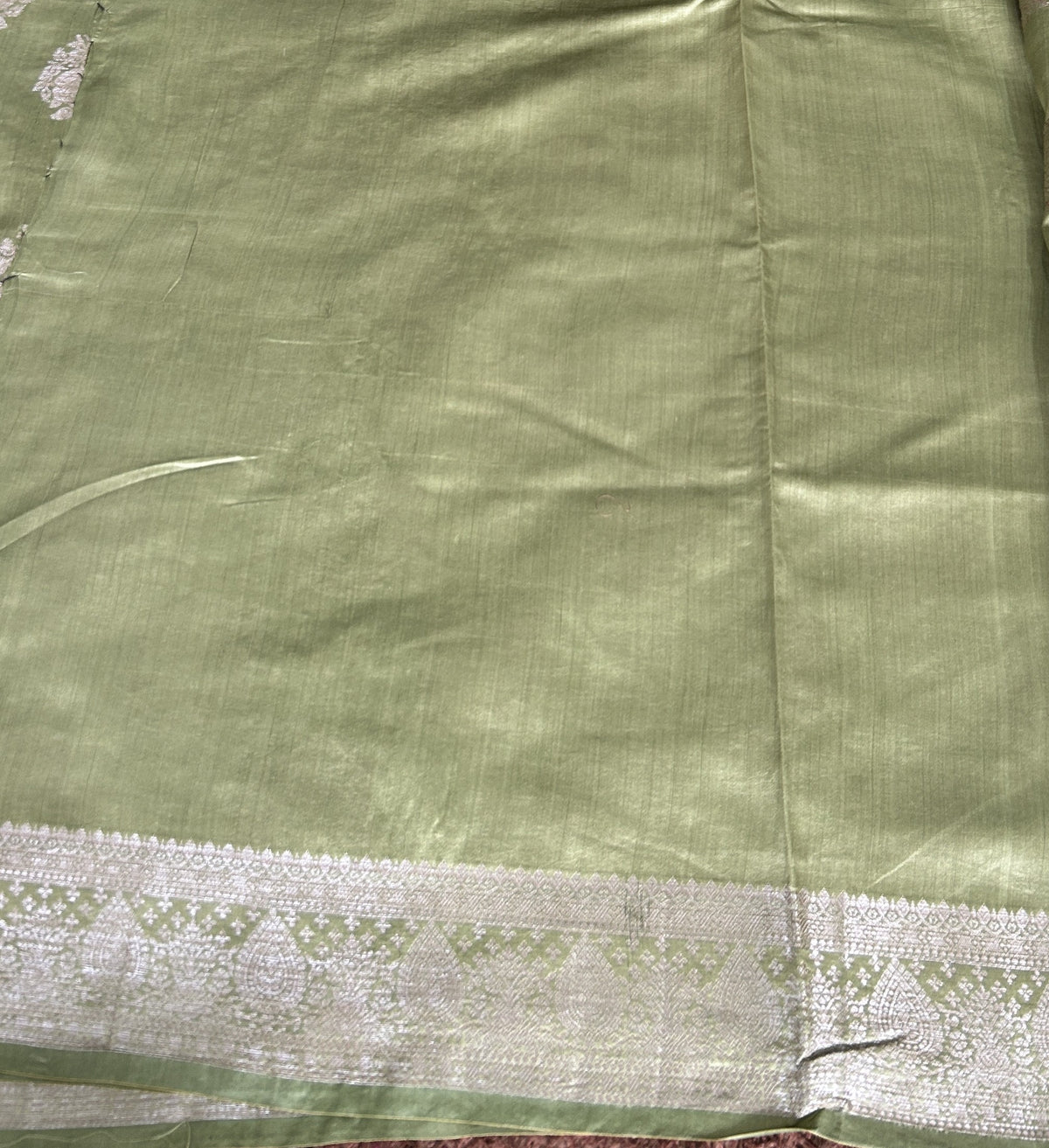 Pure Chiniya Silk Saree Mint Light Green Colored Elegantly Paired with a Gold Zari Border.