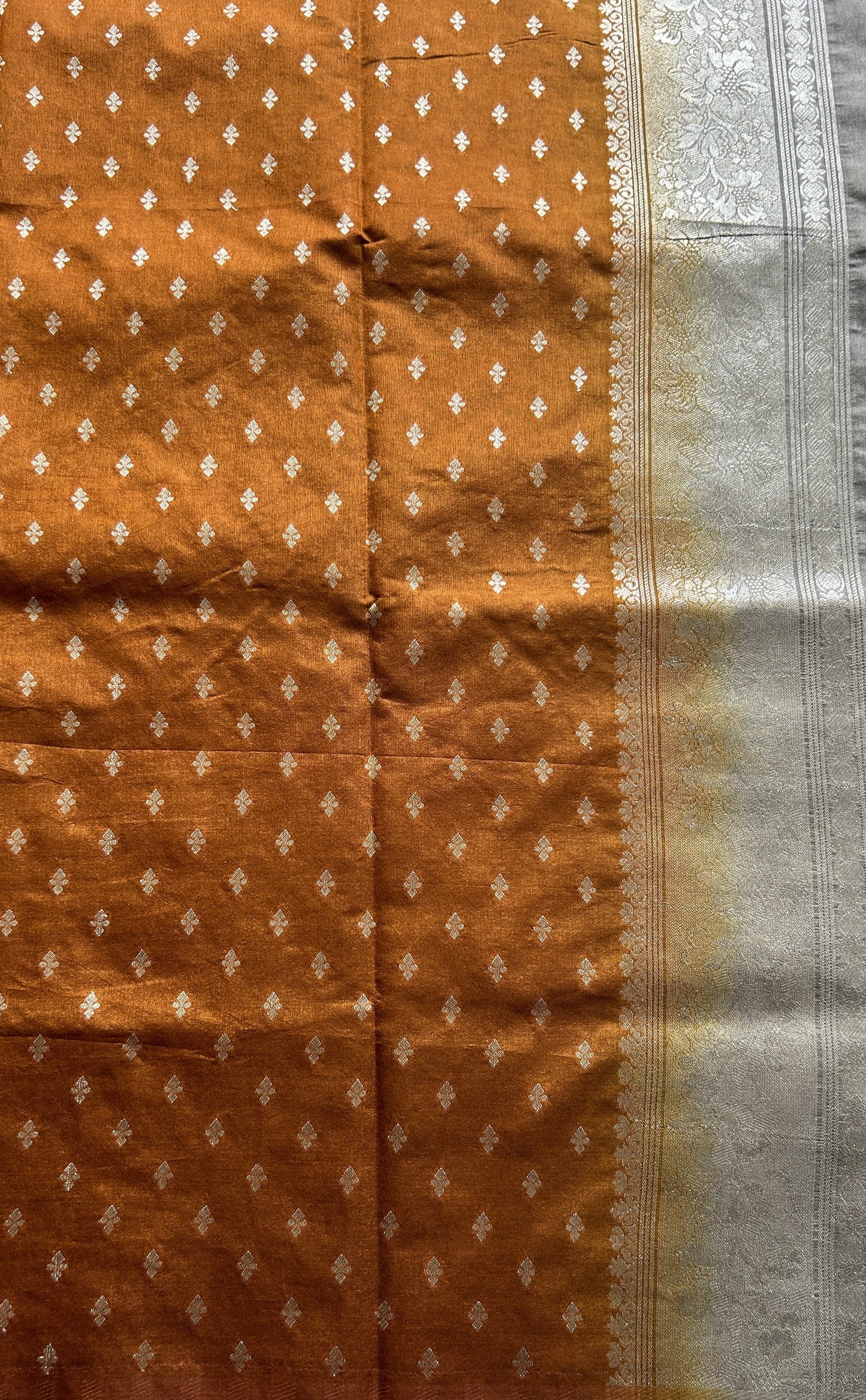 Semi Raw Silk Allover Saree Cement Colored Complemented with a Zari Border. - Sampradaya Designer Studio