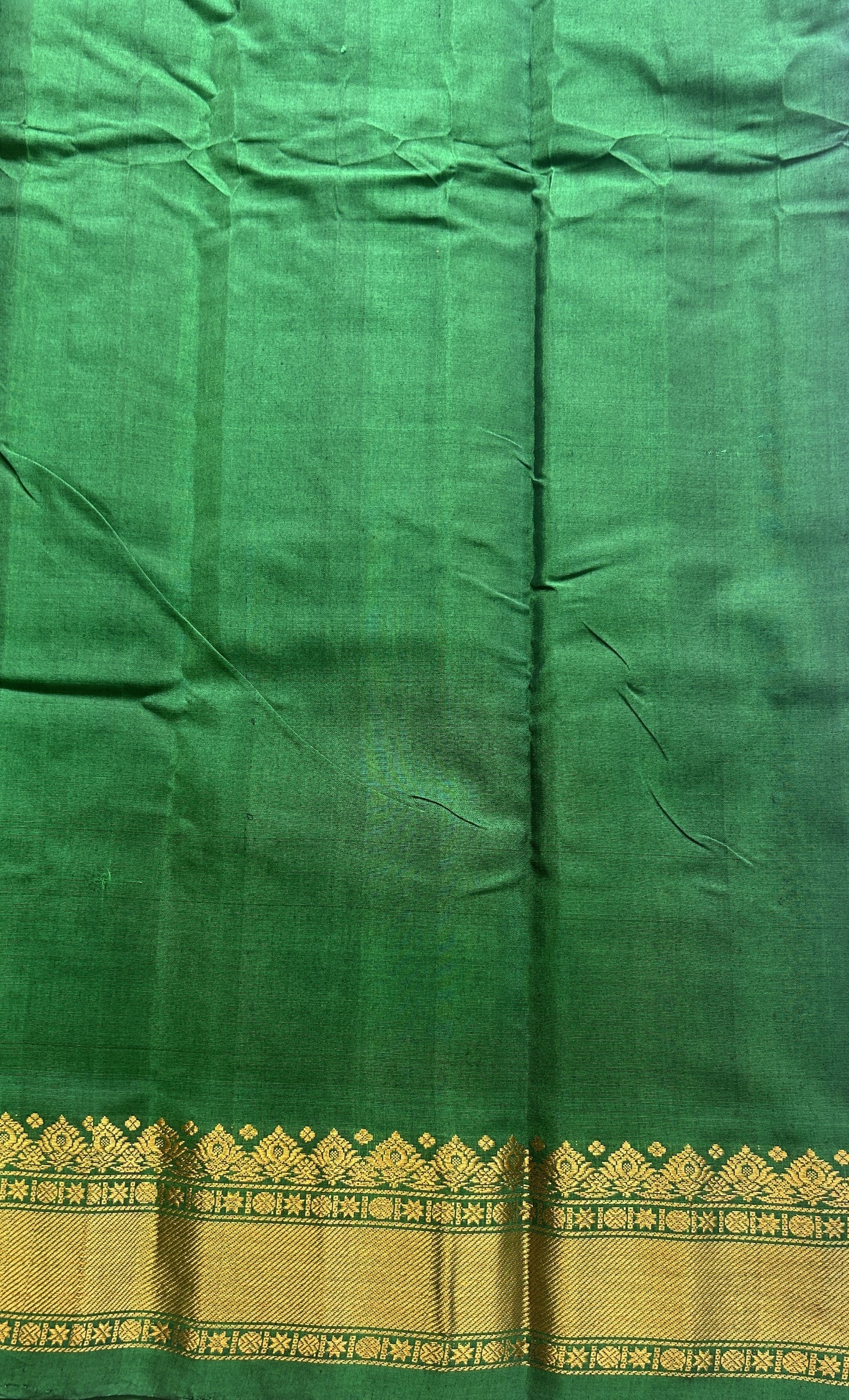 Gadwal Sico Saree Brinjal colored complemented with a Green Zari Border. - Sampradaya Designer Studio