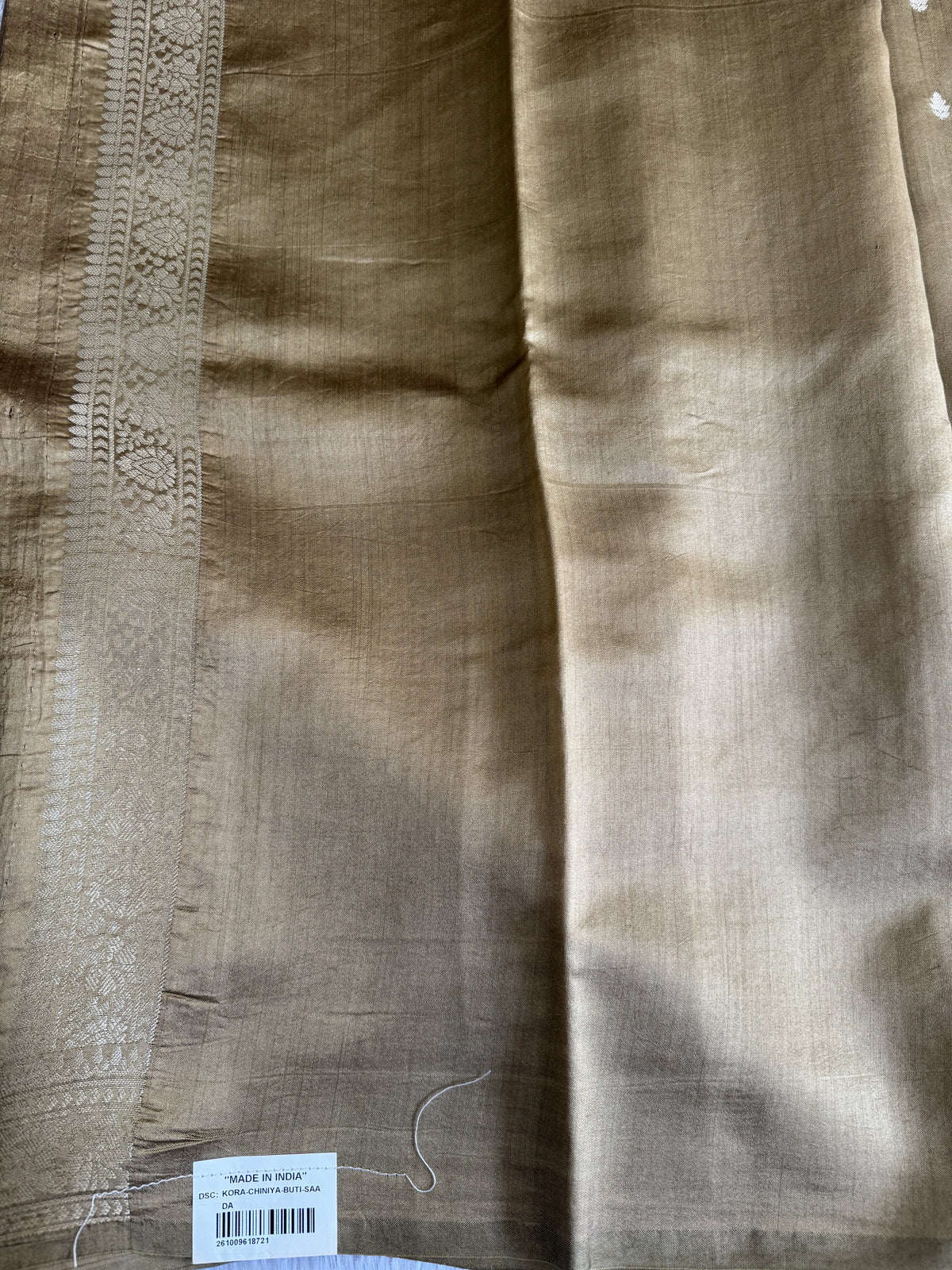 Pure Chiniya Silk Saree Gold Colored Elegantly Paired with a Gold Zari Border.