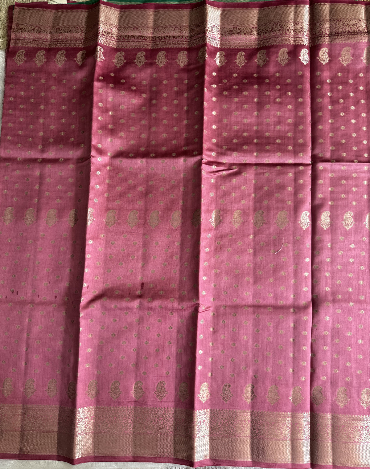 Pure Chiniya Silk Saree Baby Pink Colored Elegantly Paired with a Gold Zari Border.
