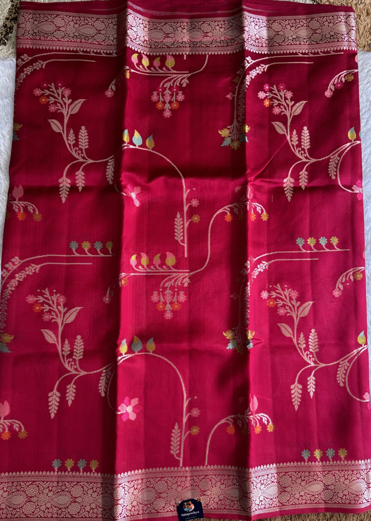 Pure Chiniya Silk Saree Rani Pink Colored Elegantly Paired with a Gold Zari Border.