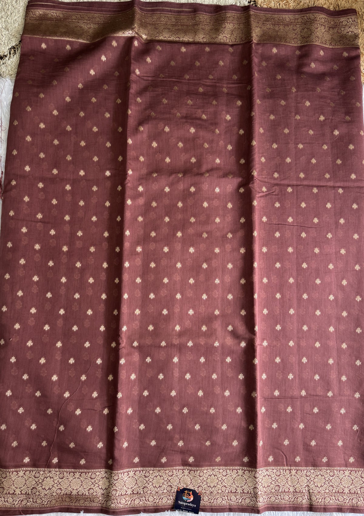 Pure Chiniya Silk Saree Walnut PColored Elegantly Paired with a Gold Zari Border.
