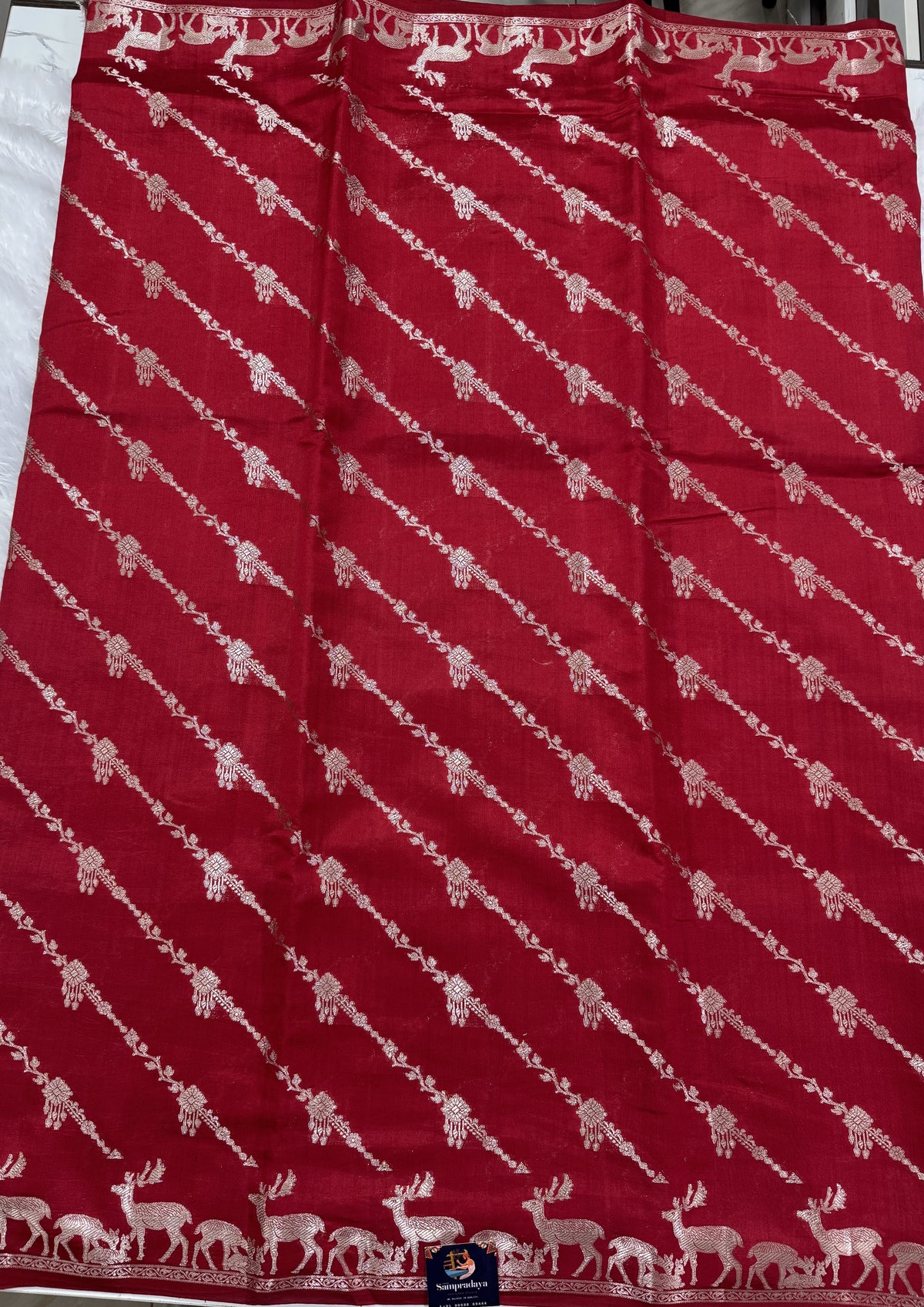 Pure Chiniya Silk Saree Red Colored Elegantly Paired with a Gold Zari Border.
