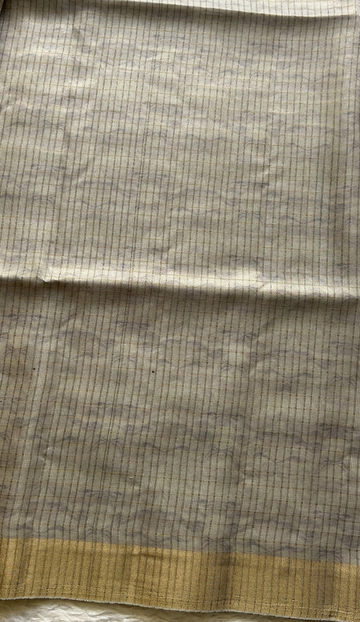 Semi Tussar Saree Light Ash Colored complemented with a Zari Border. - Sampradaya Designer Studio