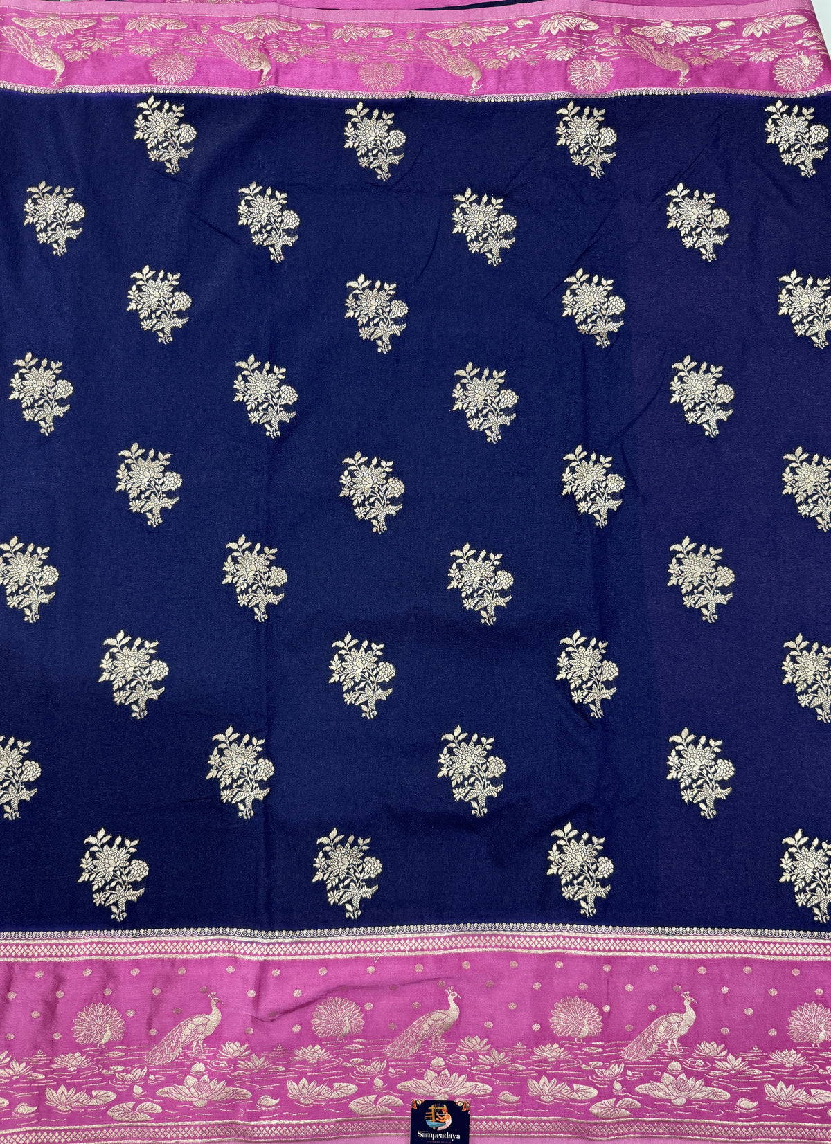 Banarasi Fancy Saree Navy Blue Colored Complemented with a Pink Zari Border.