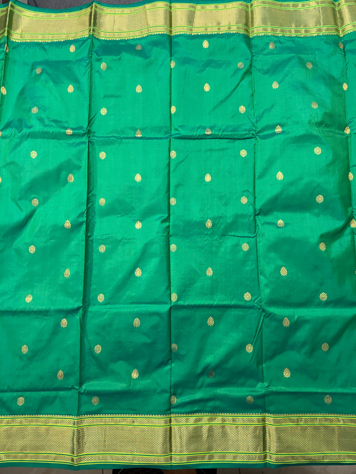 Narayanpet Silk Saree Green Colored Complemented with a Green Zari Border.