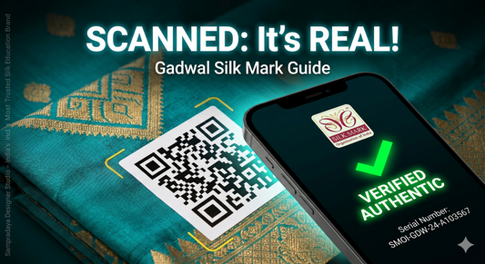 The phone screen clearly displays a prominent green checkmark with 'VERIFIED AUTHENTIC' text, the official 'Silk Mark Organisation of India' logo, and the specific serial number, confirming the saree's genuine handloom status