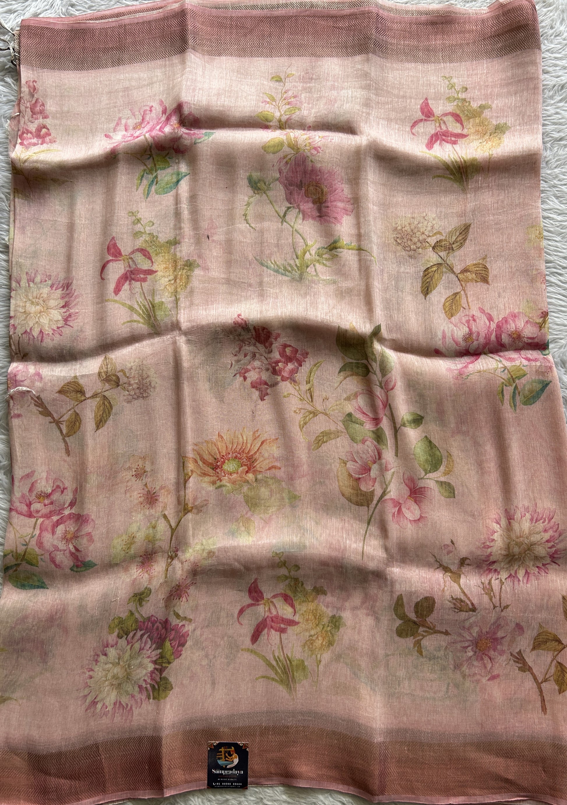 Pure Linen Saree Pink Colored Complemented with a Zari Border. - Sampradaya Designer Studio