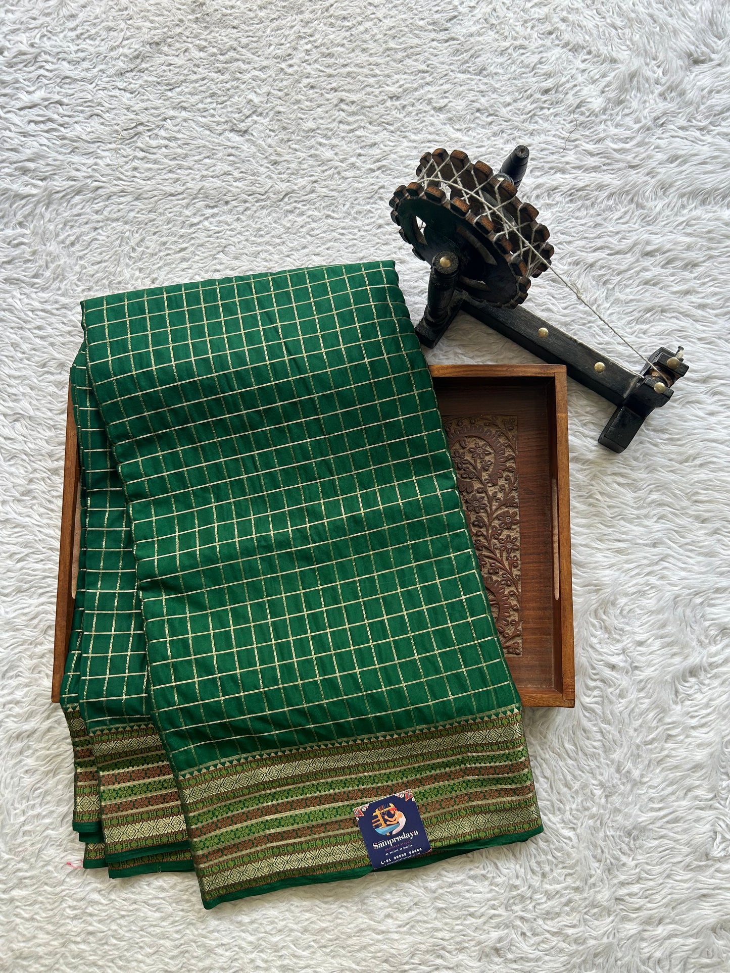 Pure Banarasi Crepe Silk Saree Bottle Green Colored Complemented with a Zari border. - Sampradaya Designer Studio