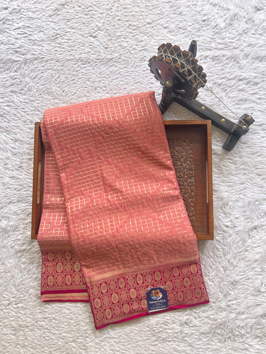 Pure Banarasi Crepe Silk Saree Peach Colored Complemented with Zari border. - Sampradaya Designer Studio