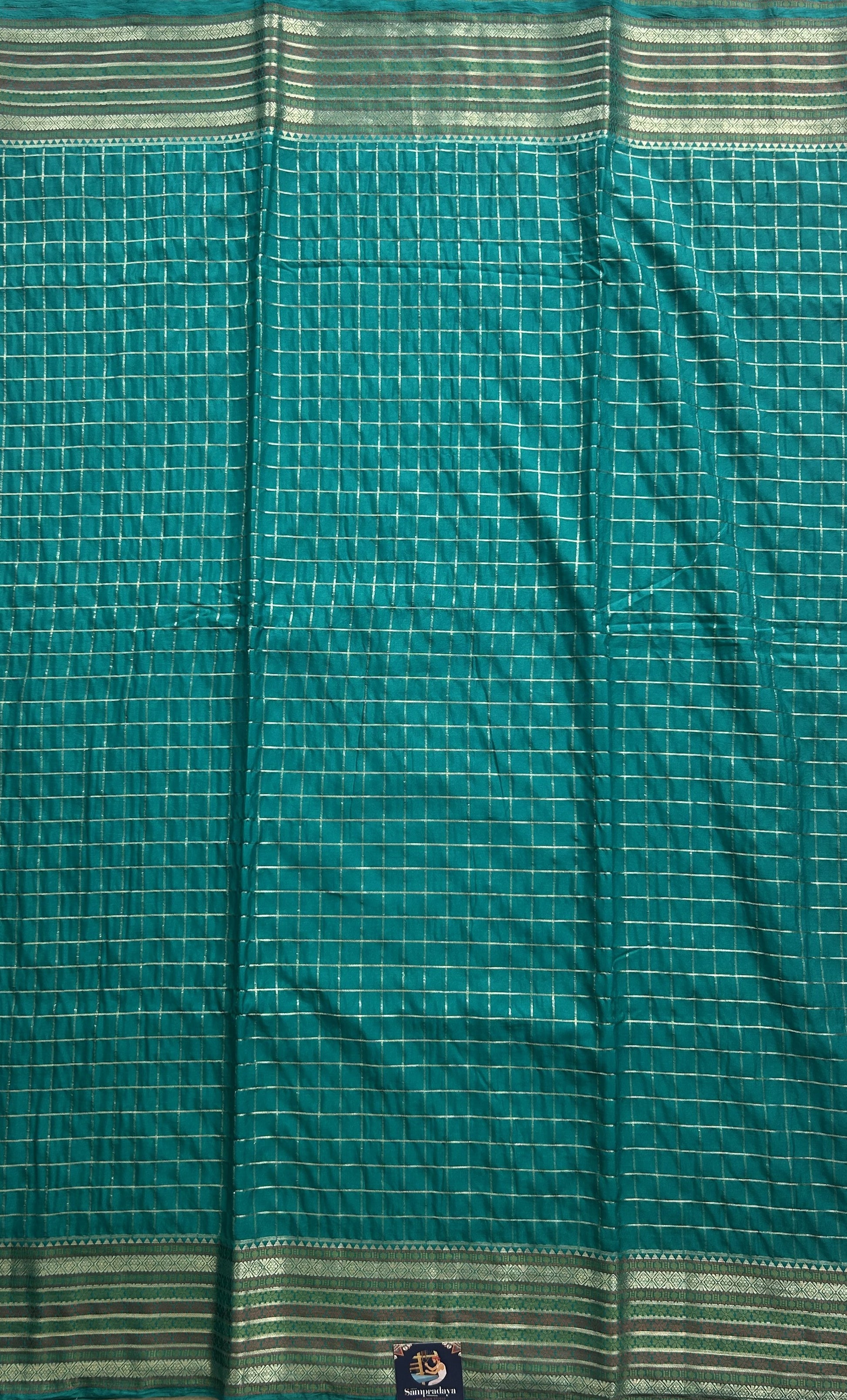 Pure Banarasi Crepe Silk Saree Aqua Blue Colored Complemented with a Zari border. - Sampradaya Designer Studio