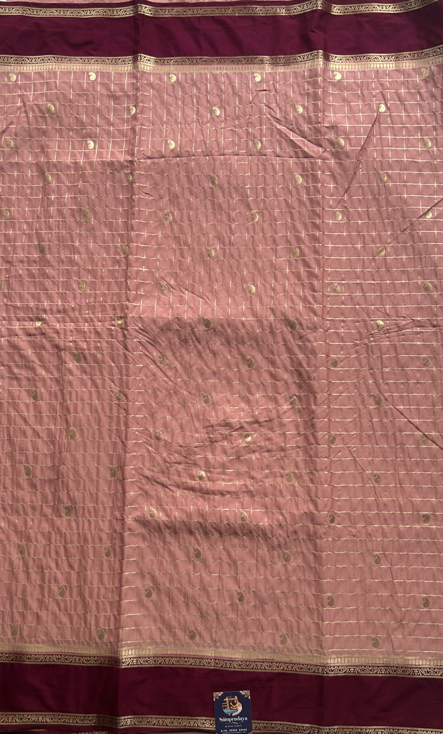 Pure Banarasi Crepe Silk Saree Peach Colored Complemented with a Zari border. - Sampradaya Designer Studio
