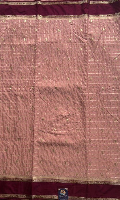 Pure Banarasi Crepe Silk Saree Peach Colored Complemented with a Zari border. - Sampradaya Designer Studio