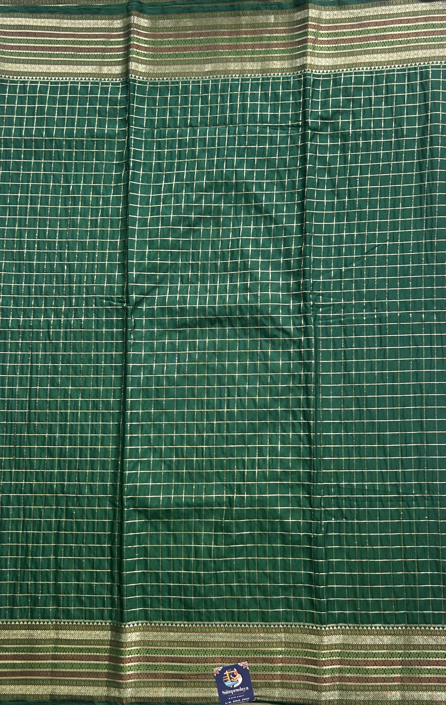 Pure Banarasi Crepe Silk Saree Bottle Green Colored Complemented with a Zari border. - Sampradaya Designer Studio