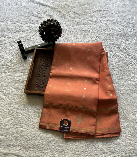 Satin Georgette Saree Pale Orange Colored Elegantly Paired with a Zari Border. - Sampradaya Designer Studio