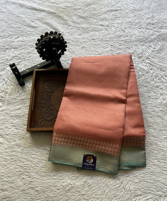 Viscose Georgette Saree Peach Colored Complemented with a Sea Blue Zari Border. - Sampradaya Designer Studio