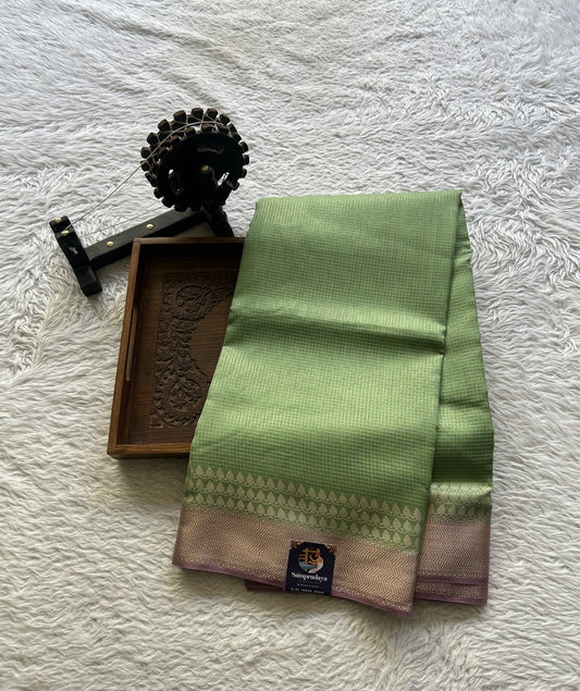 Viscose Georgette Saree Light Green Colored Complemented with a Lilac Zari Border. - Sampradaya Designer Studio