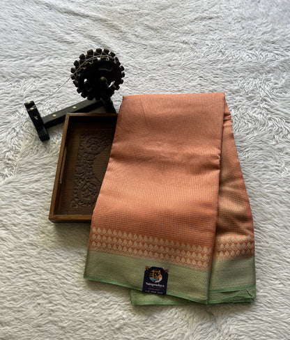 Viscose Georgette Saree Peach Colored Complemented with a Light Green Color Zari Border. - Sampradaya Designer Studio