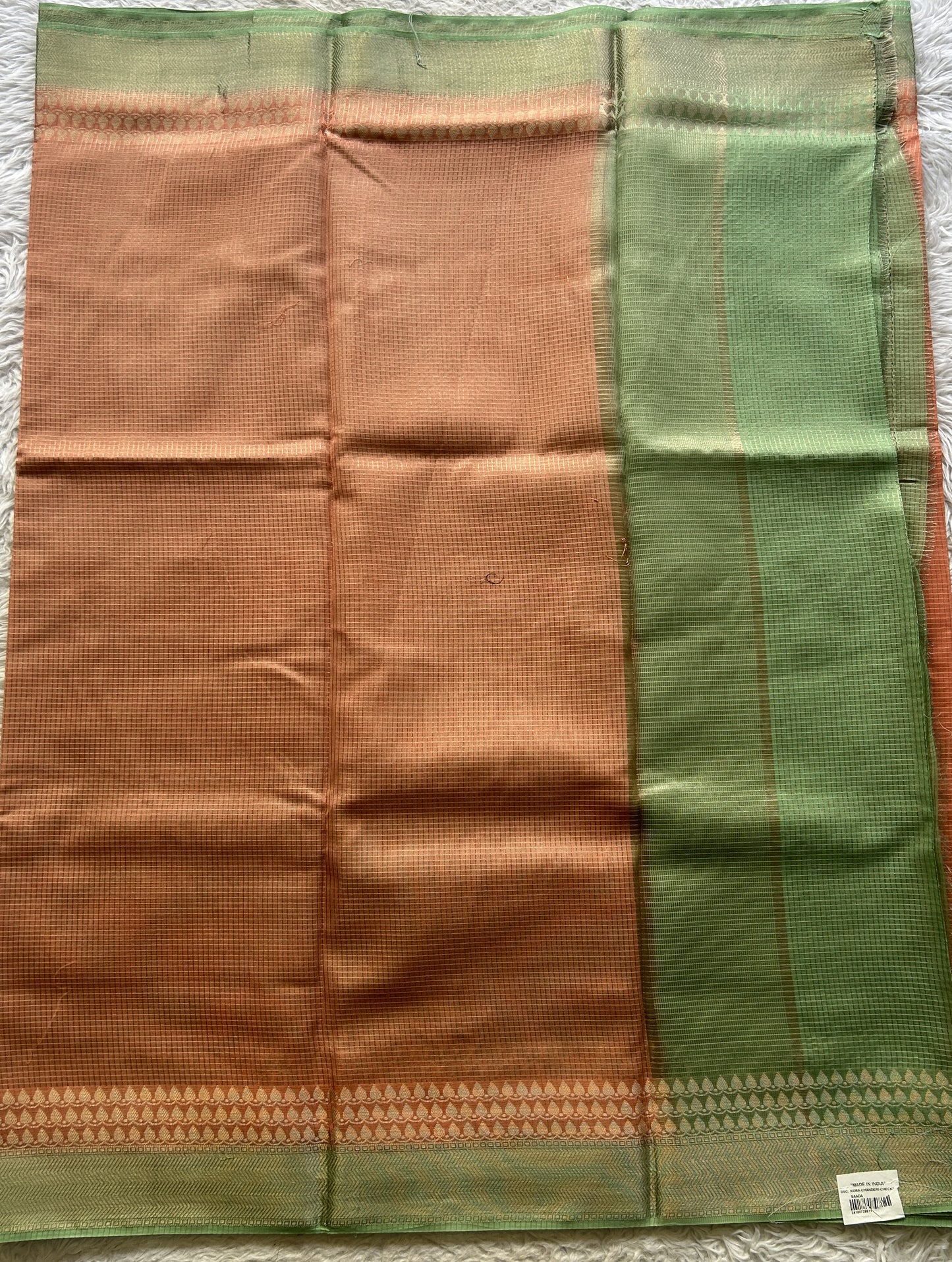 Viscose Georgette Saree Peach Colored Complemented with a Light Green Color Zari Border. - Sampradaya Designer Studio