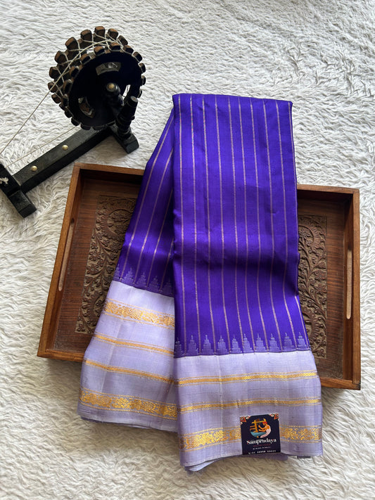 Gadwal Silk Saree Royal blue Colored Complemented With Lavender color and gold Zari Weaving Border - Sampradaya Designer Studio