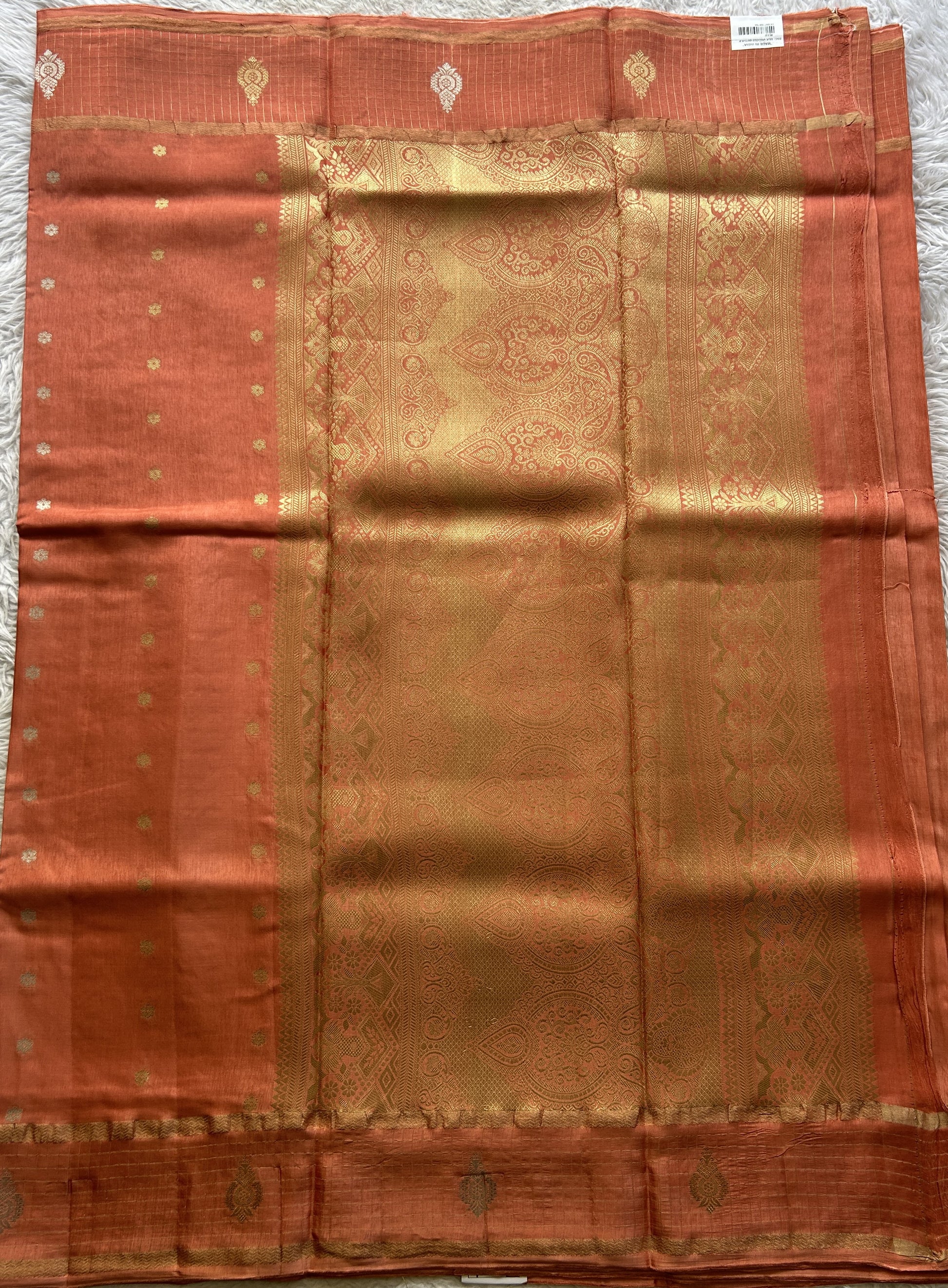 Satin Georgette Saree Pale Orange Colored Elegantly Paired with a Zari Border. - Sampradaya Designer Studio