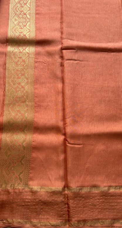 Satin Georgette Saree Pale Orange Colored Elegantly Paired with a Zari Border. - Sampradaya Designer Studio
