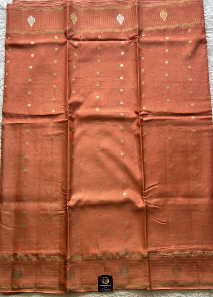 Satin Georgette Saree Pale Orange Colored Elegantly Paired with a Zari Border. - Sampradaya Designer Studio