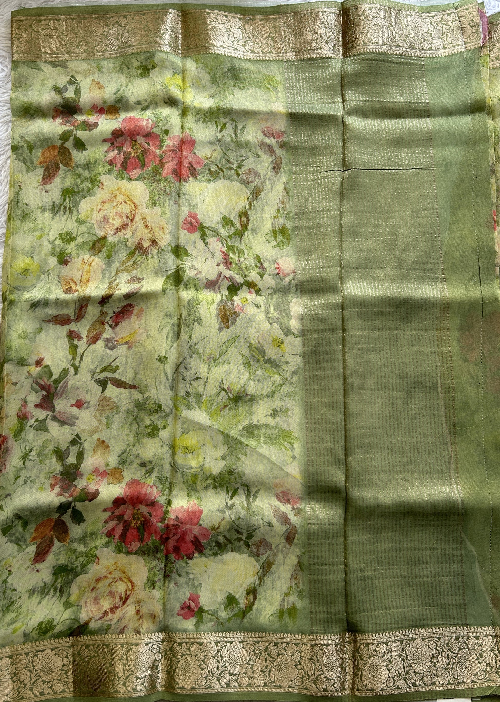 Viscose Tissue Georgette Saree Light Green Colored Complemented with a Zari Border. - Sampradaya Designer Studio