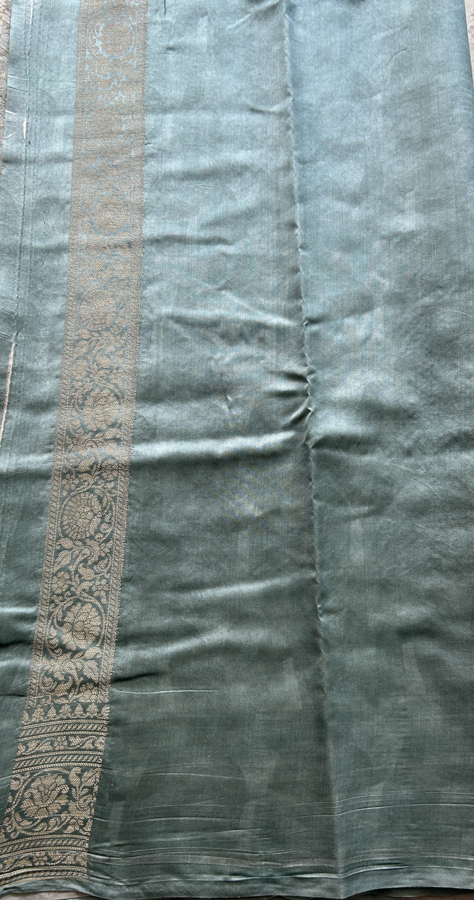 Chiniya Silk Saree Off White Colored Elegantly Paired with a Sea Blue Color Zari Border. - Sampradaya Designer Studio